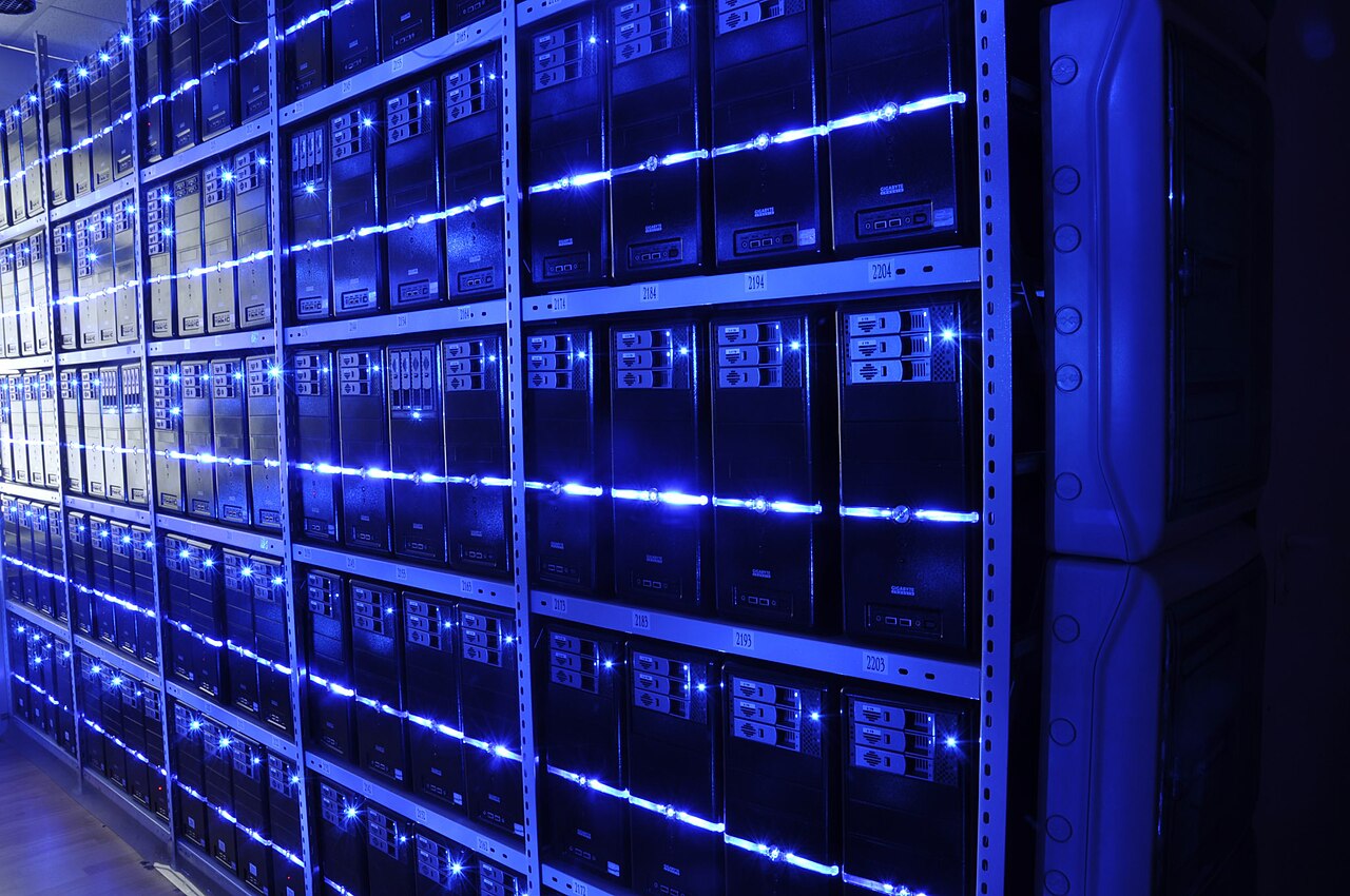 Cloud cost optimisation in practice: illuminated server racks in a data centre