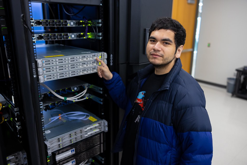 Engineers inspecting data centre racks during a cloud migration cutover