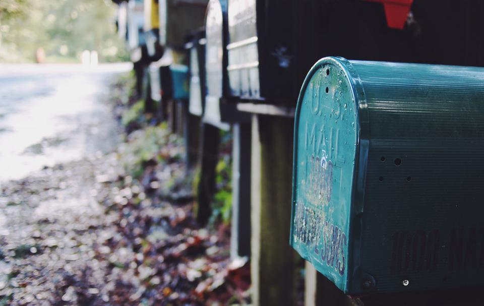 Rows of numbered mailboxes illustrating DMARC enforcement across a whole client base