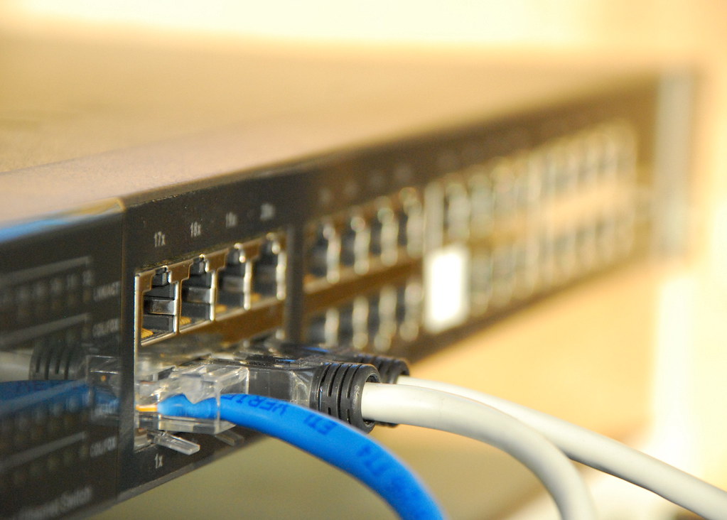 IPv6 readiness work starts at the network switch: free ports and patch cables in an office comms cabinet